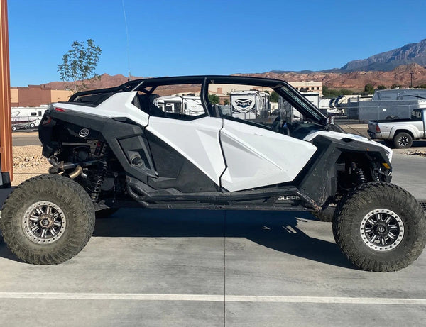 voodoo polaris pro xp rollcage installed on white and black 4 seat pro xp 